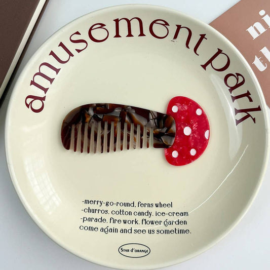 Decorative plate with a mushroom-shaped comb on a 'Amusement Park' theme