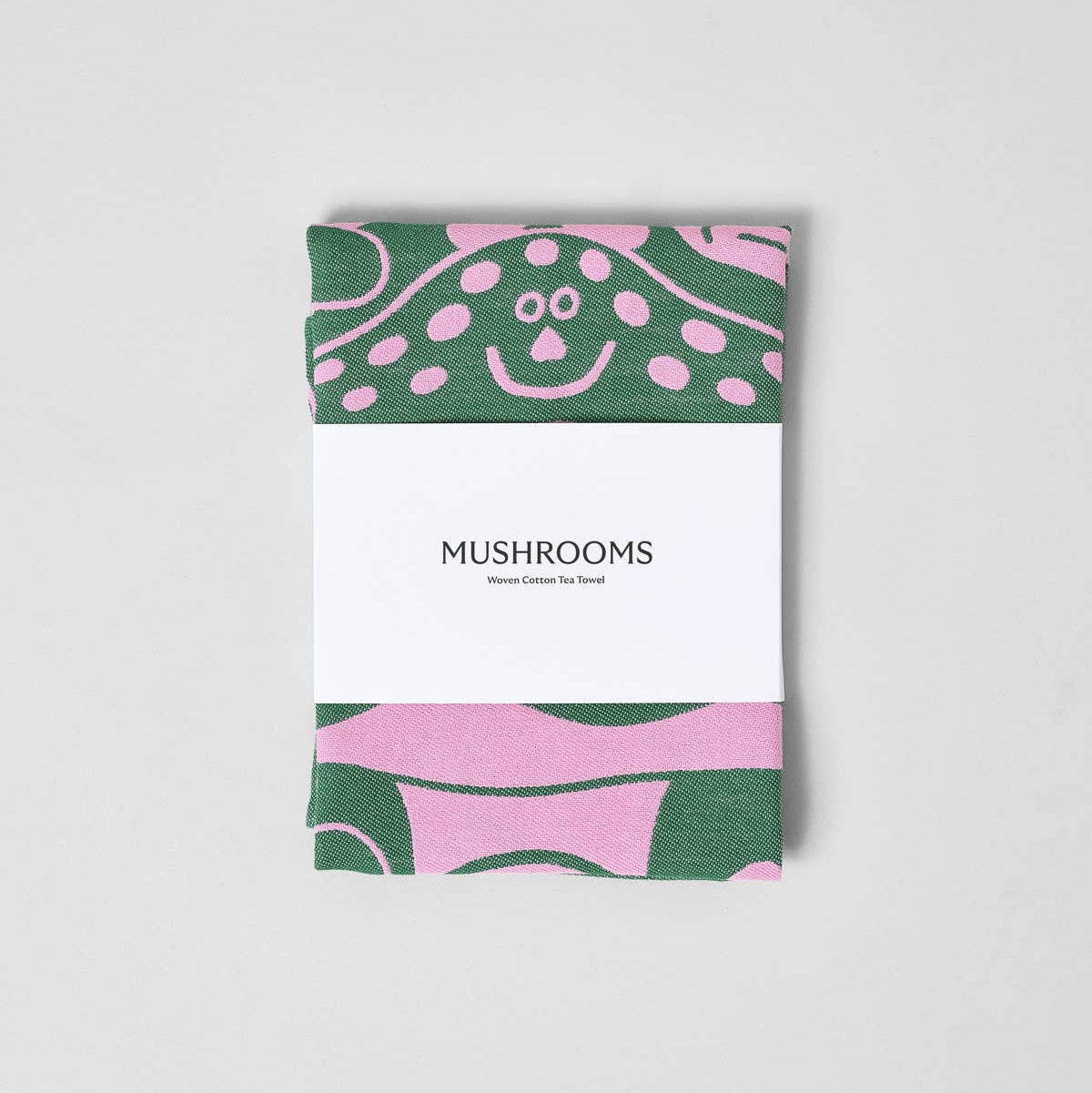 Mushroom towel with a green and pink abstract pattern on a white background