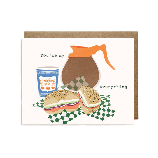 Card with coffee-themed illustration including a coffee pot, new york coffee cup, and an everything bagel with lox and cream cheese on a checkered tablecloth. Text reads "You're my everything" 