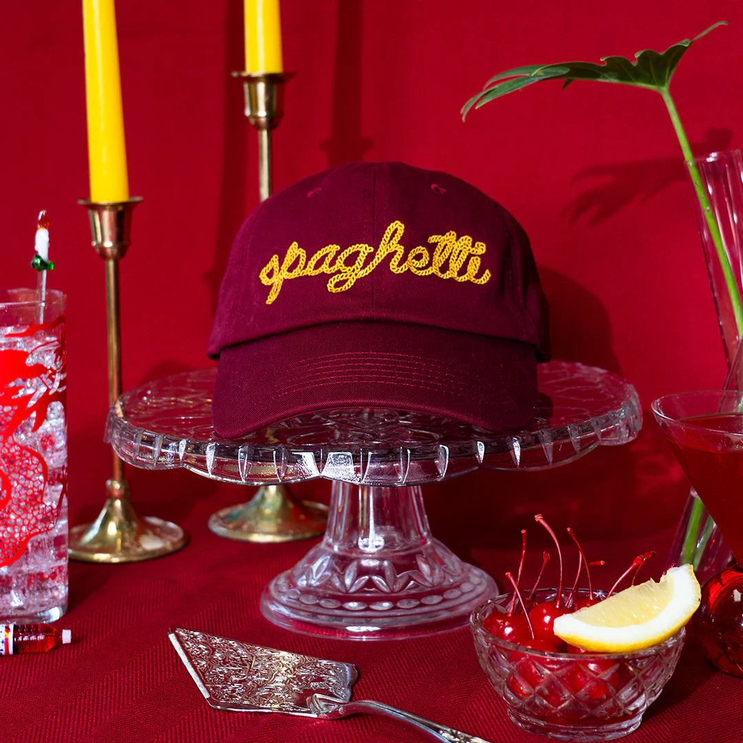 Spaghetti Hat staged with elaborate dinnerware.