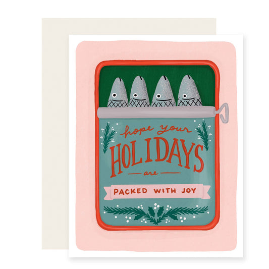 Holiday card with illustration of four sardines packed into a tinned can with text on it that reads "Hope your holidays are packed with joy", on a white background