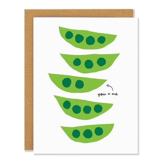 Greeting card with graphic print of five fresh green pea pods in a row. A small arrow points to a pod with two individual peas, text next to it reads "you + me."