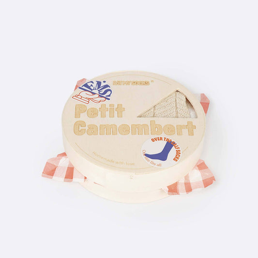 A round package of socks that look like Petit Camembert cheese on a plain white background, wrapped in a red-and-white checkered paper band.