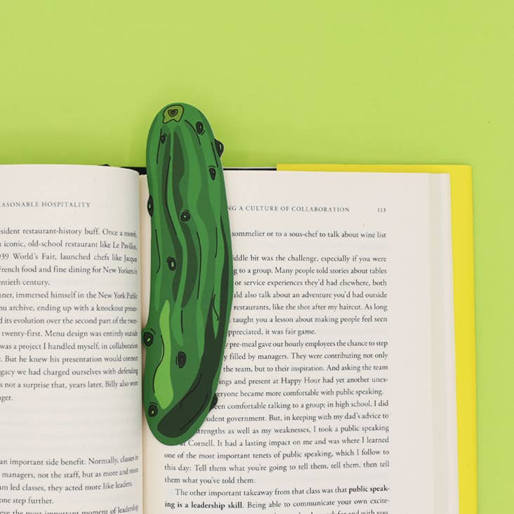 Bookmark that looks like a whole dill pickle inside of a book 