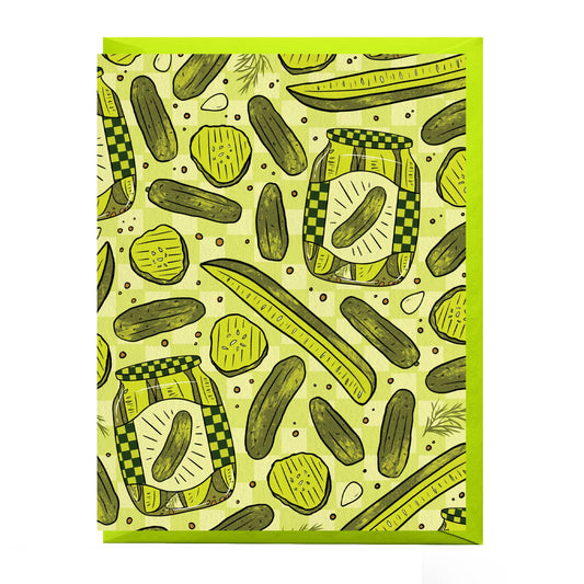 Card is blank and features a repeating pattern of pickle jars, pickle slices and spears in a green checkerboard motif.