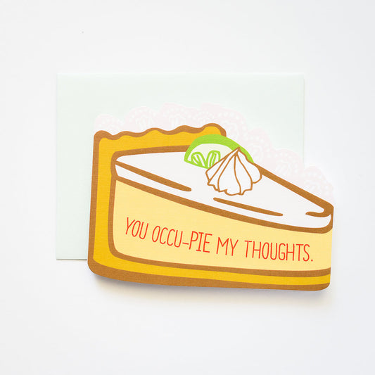 Slice of pie card that says "You occu-pie my thoughts."