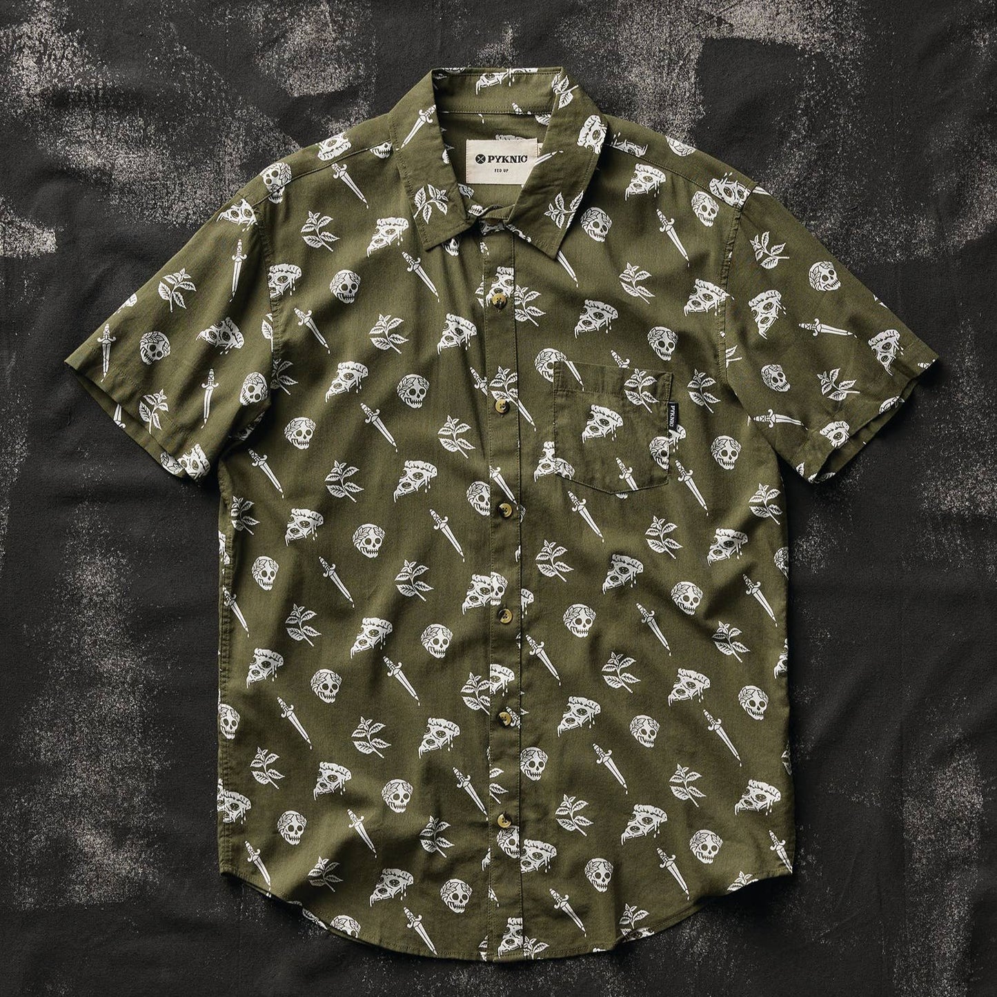 button up shirt that is oregano green with skulls, pizza and swords on it. 