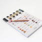 Cozy cafe pretend play notepad with a pencil on a white background, featuring a menu design.