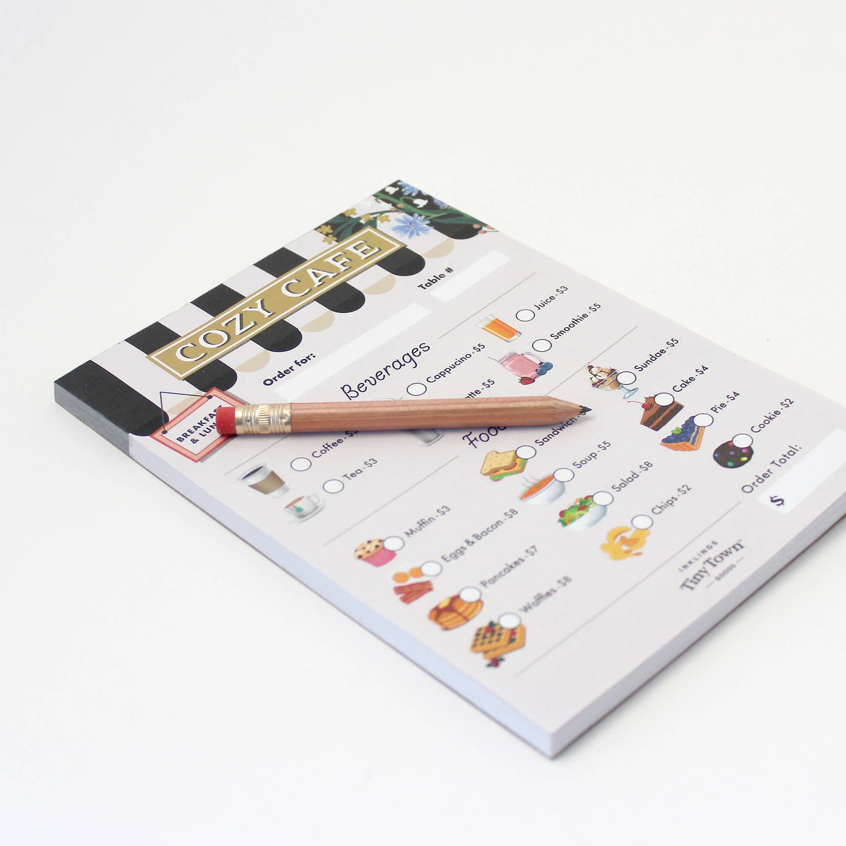 Cozy cafe pretend play notepad with a pencil on a white background, featuring a menu design.