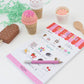 Ice cream-themed children's menu with toys on a white surface