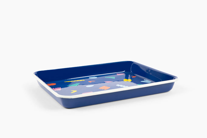 blue enamel tray with colorful shapes on it 