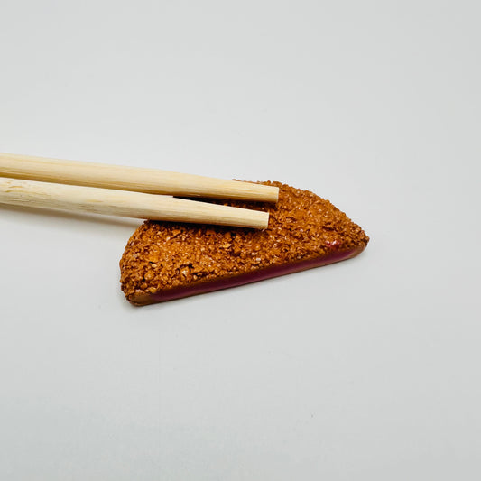 Pork Cutlet Chopstick Rest with chopsticks on top.