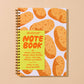 A spiral-bound notebook with a white cover decorated with a pattern of orange-brown potatoes, featuring a bright yellow front cover with the text 'AND HERE WE ARE! NOTE BOOK'.