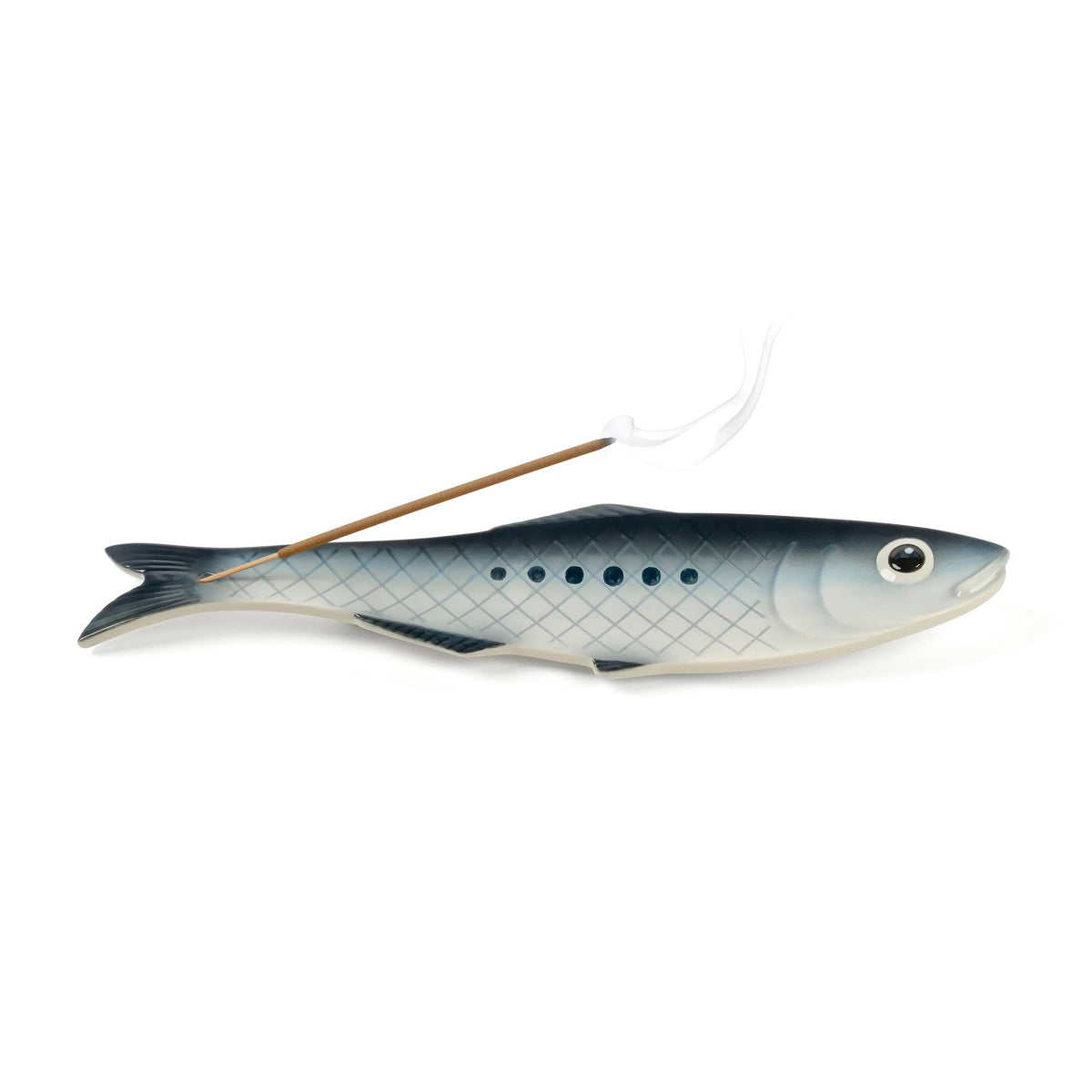 A fish-shaped incense holder with a small incense stick inserted, shown against a plain white background.
