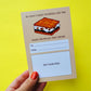 Gift card holder that has image of s'more in top center with text that reads "We need s'more teachers like you. Thank you for all that you do!" and has space to place a gift card .