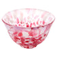 red and white glass sake cup on a white background