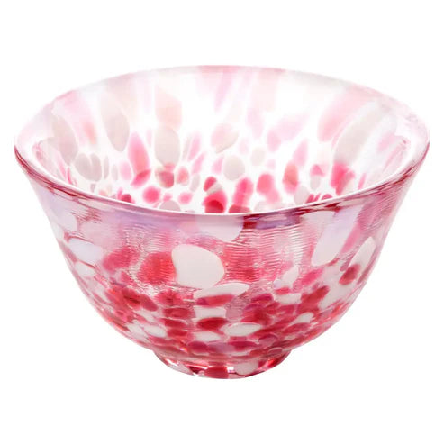 red and white glass sake cup on a white background