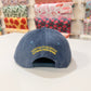 Back of Salami hat showing text that says: Mister Parmesan Olympia Provisions