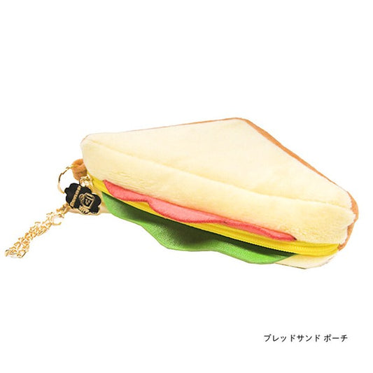 Pouch that looks like a sandwich that has cheese, lettuce and tomato inside.