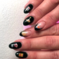 Feast of Seven Fishes themed nail decals  - includes scungilli, clams, calamari, shrimp cocktail, tomato can, chianti bottle, wine glass, christmas bows and holly, and more. Shown on nails painted in black.