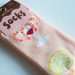 Close up of shrimp cocktail socks in packaging 