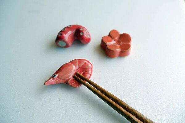 Chopstick holders. One prawn, one octopus and one flower.