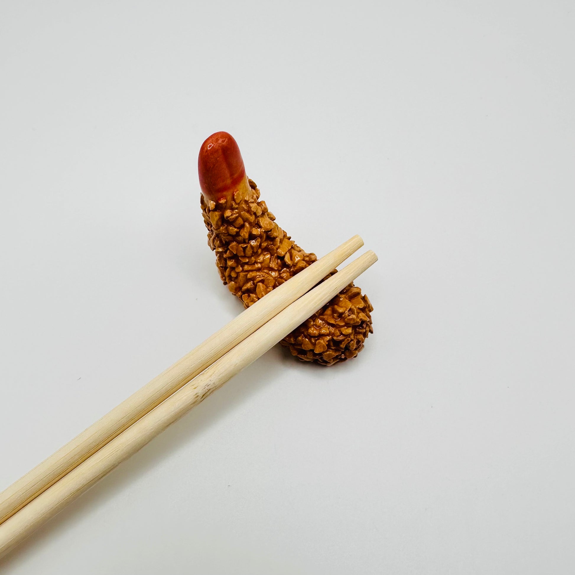 Shrimp Tempura Chopstick Rest with chopstick resting on top.