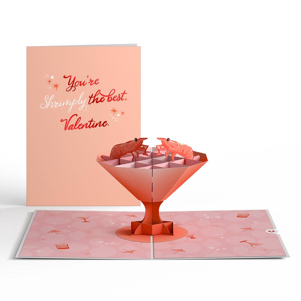 Two cards side by side so you can see the front cover of the card that says "Youre shrimply the best". THe inside of the card has a large pop-up of two shrimp drinking martinis.