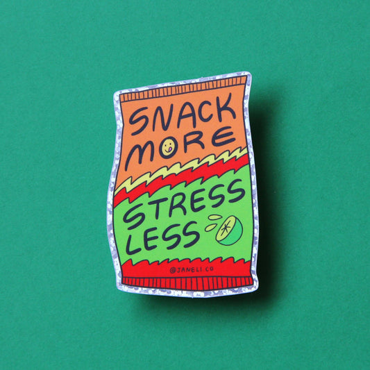 sticker with 'Snack More Stress Less' text on a green background