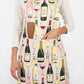 Person wearing an apron with wine-themed design on a white background