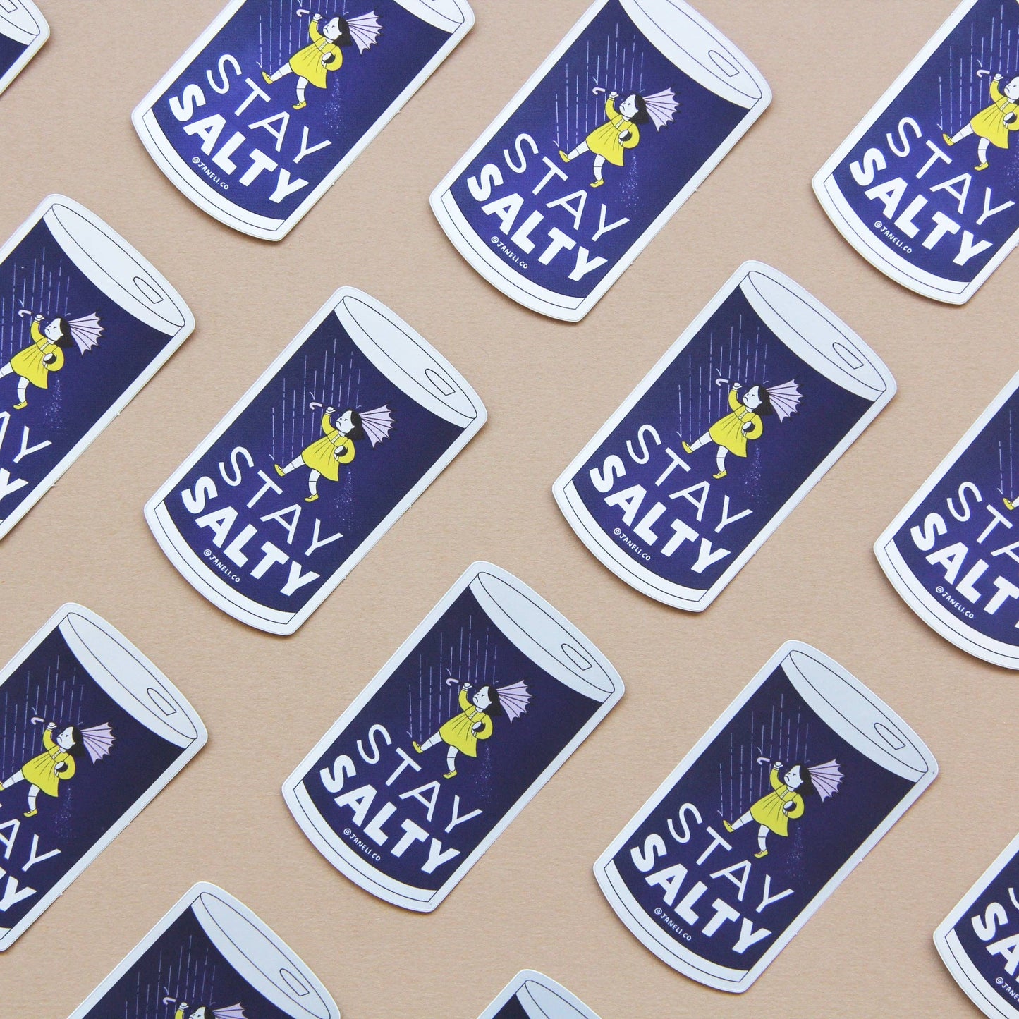 Pattern of 'Stay Salty' salt shaker stickers on a beige background
