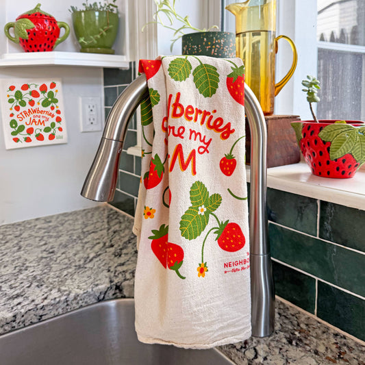 Strawberry design kitchen towel hanging from sink faucet 