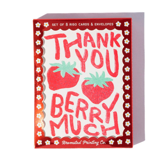 A boxed set of Riso cards and envelopes featuring a strawberry-themed design with the words 'THANK YOU BERRY MUCH' in red lettering on a white background, surrounded by a red border with small white flowers. The brand 'Bromsted Printing Co.
