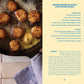 Butter-basted scallops in a pan with Beurre Blanc recipe on the side.