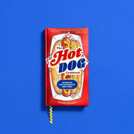 Red cookbook titled 'The Hot Dog Cookbook' on a blue background