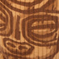 Close-up of a textured surface with intricate brown patterns on a white background