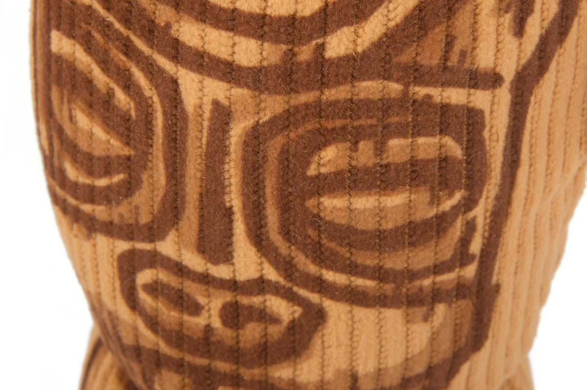 Close-up of a textured surface with intricate brown patterns on a white background