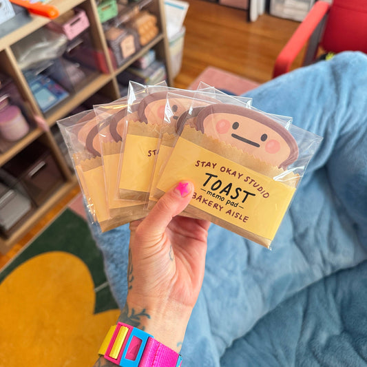 toast it note memo pads held in a hand 