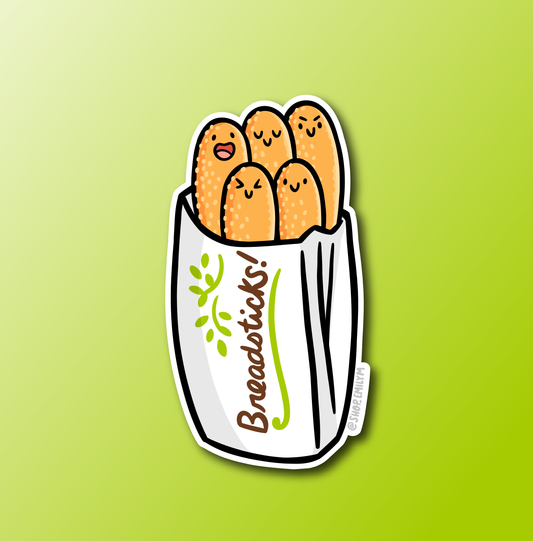 A die-cut sticker featuring a white paper bag filled with cute, smiling orange-brown breadsticks, shown on a bright green gradient background.