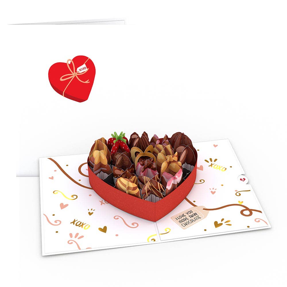 Card showing a die-cut card that looks like a chocolate box. Envelope attached is white with a heart shaped outer box.