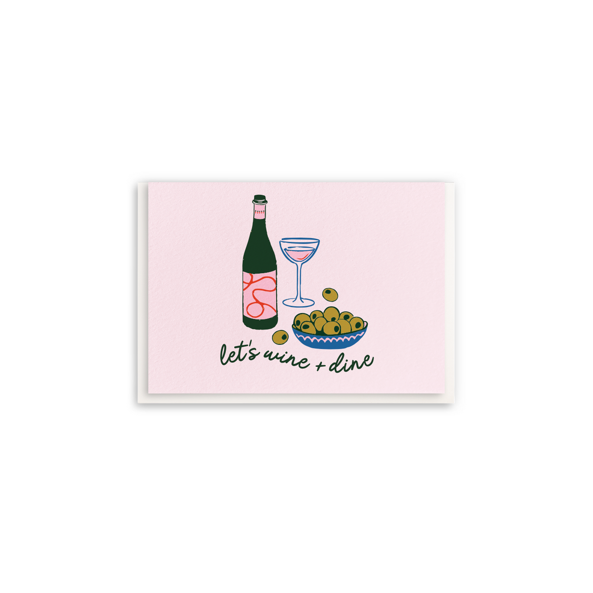 A square greeting card with a light pink background featuring an illustration of a wine bottle, a cocktail glass, olives, and the handwritten text 'let's wine + dine'.