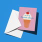 A pink greeting card with a cute ice cream cone illustration and the text 'you're my favorite flavor' layered over a white envelope, set against a solid blue background.