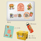 Collection of colorful burger themed stickers on a laptop, notebook, cooler box, and water bottle with text.