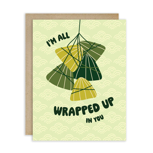 Greeting card with several Zong Zi tied together with text that reads "I'm all wrapped up in you" 