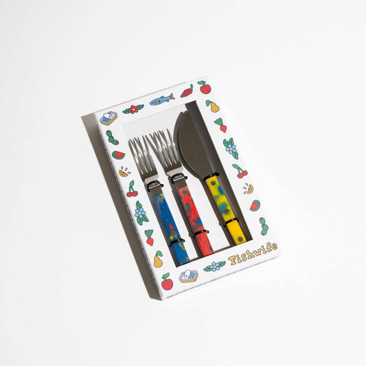 Set of tinned fish utensils consisting of two forks (blue and red) and a knife (yellow)