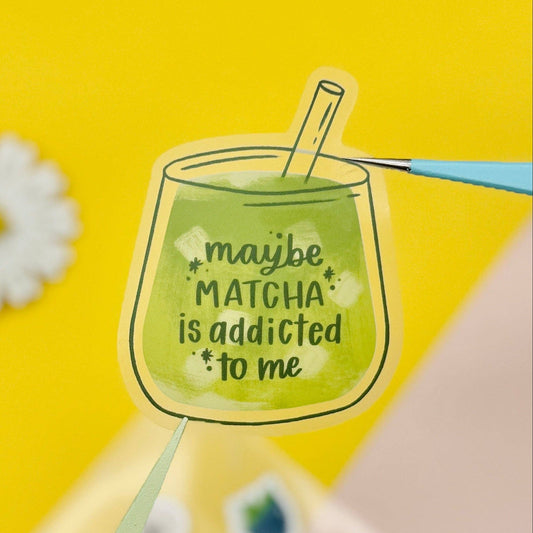 Illustration of a glass of matcha with text "maybe matcha is addicted to me" on a yellow background