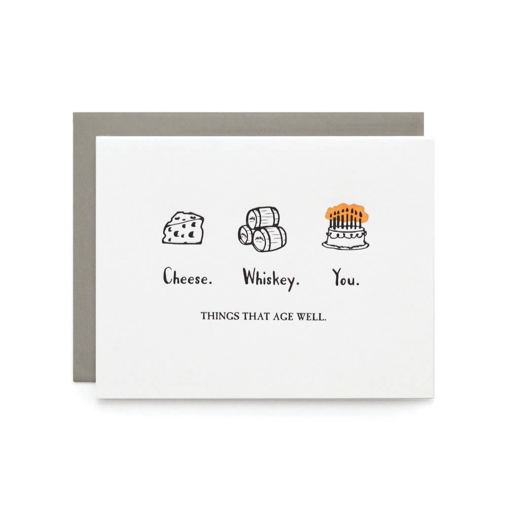 Greeting card with illustrations of cheese, whiskey, and a cake, with text 'Cheese. Whiskey. You. Things that age well' on a white background.