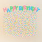 greeting card with a cake covered in round confetti sprinkles and candles on top that read "HAPPY BIRTHDAY" 