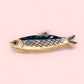 blue and white anchovy-shaped hair claw 