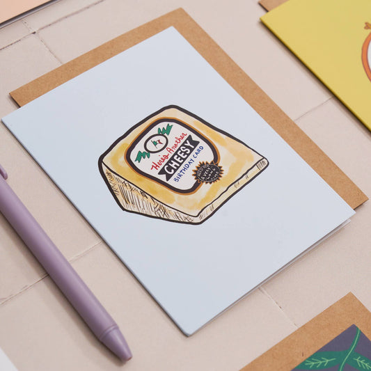 birthday card with a cheees wedge illustration on it and text that reads "Here's another cheesy birthday card" 